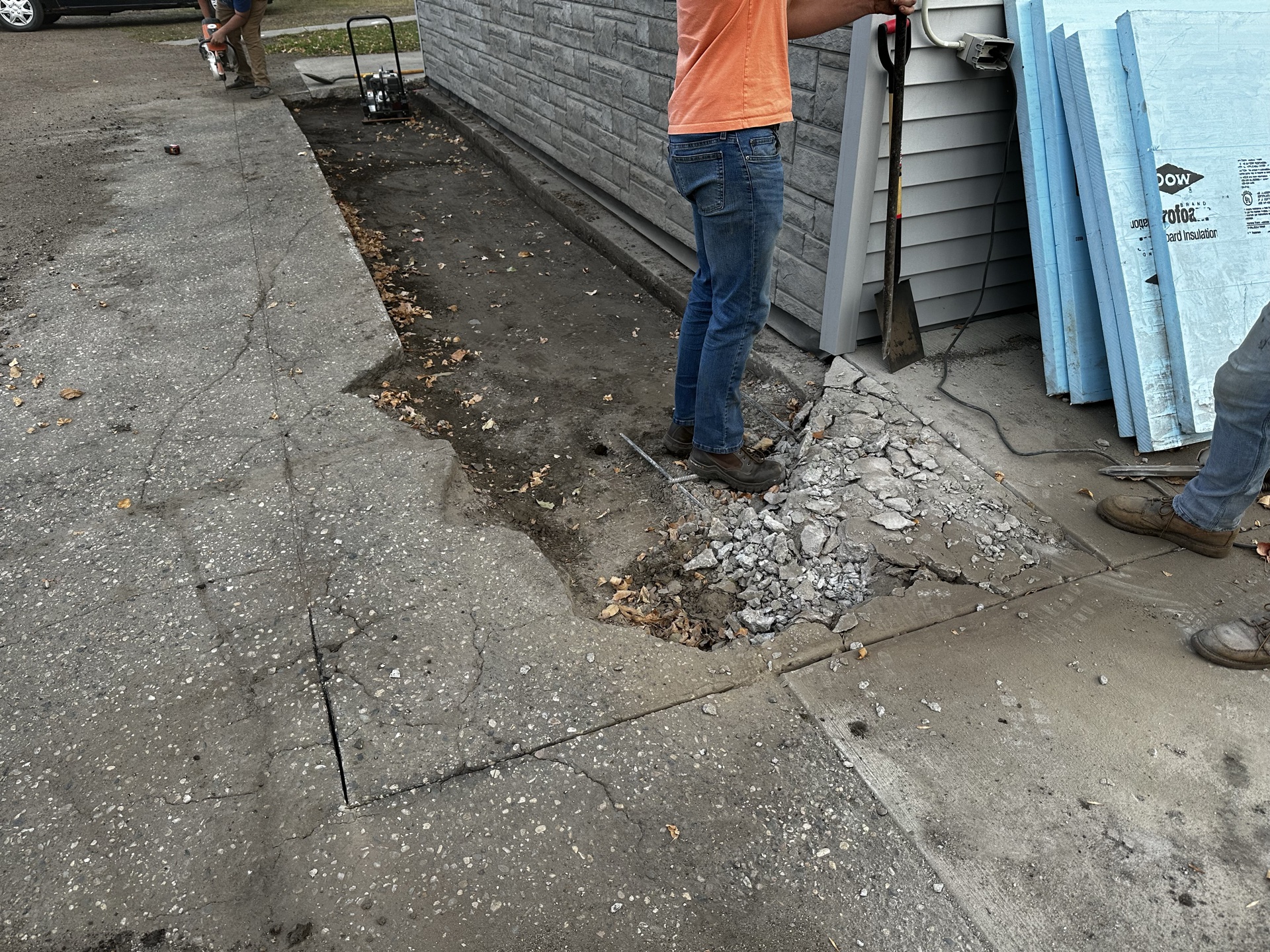 Crew working on concrete demolition