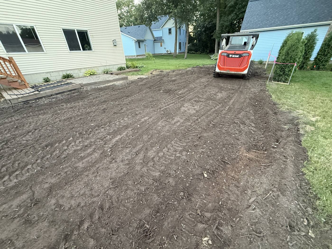 Final grading pass on the cleared ground — land leveling in St. Joseph, MN